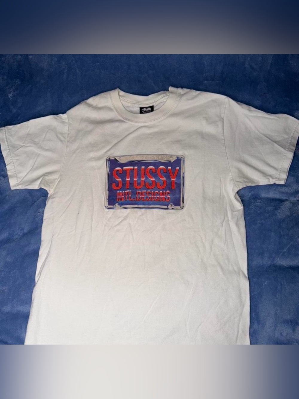 Stussy White Tee with Red and Blue Chest Graphic